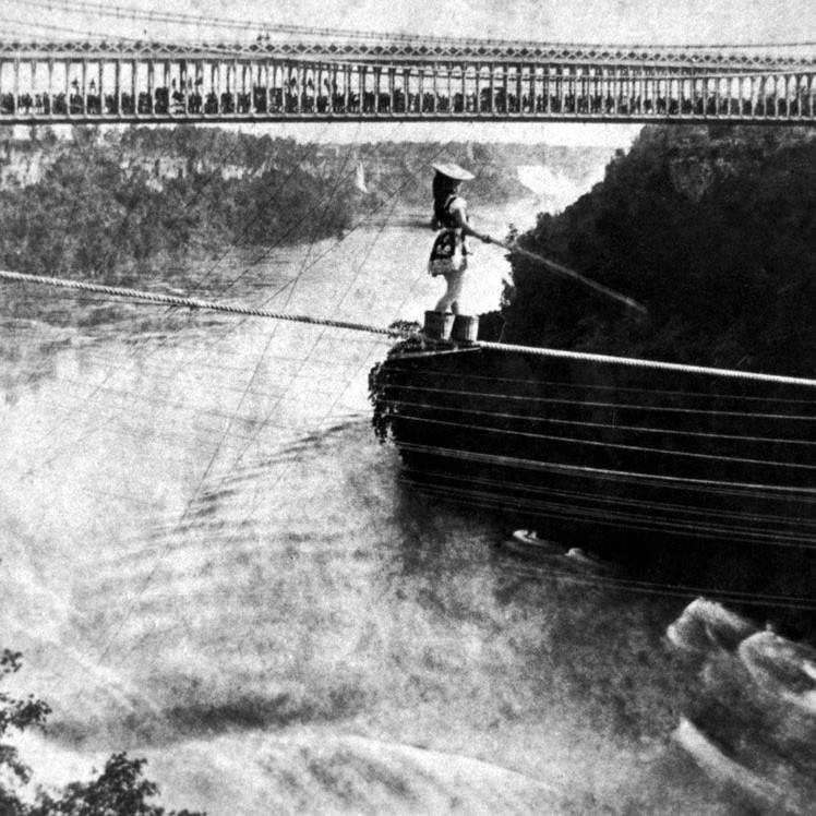 Maria Spelterini crosses Niagara on a tightrope to illustrate the precariousness of self-employment