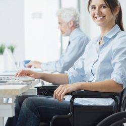 disabled people working in an office and smiling