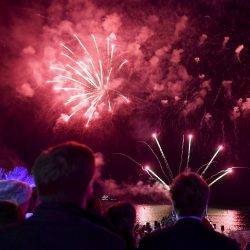 Man watching fireworks display in MIPIM, Cannes