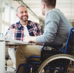 two people talking to illustrate the growing number of disabled people in self-employment