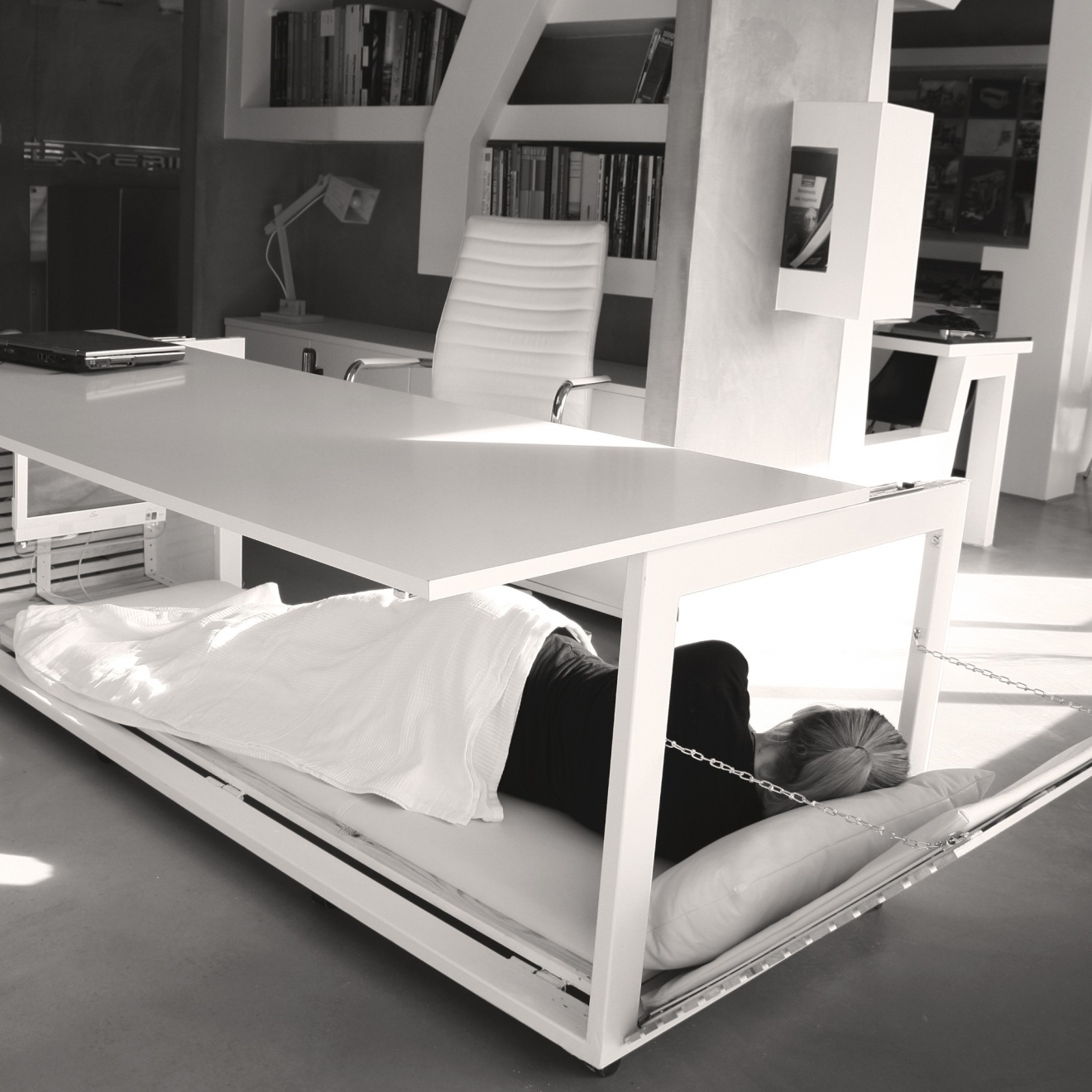 sleeping under a convertible desk