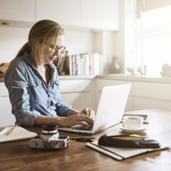 A woman working at home to illustrate flexible working