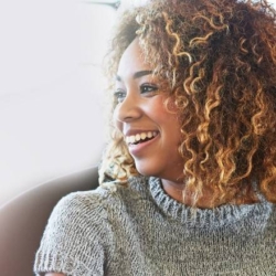 A smiling woman to depict wellbeing