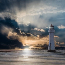 A lighthouse to illustrate the challenges of working in isolation as a metaphor for borderless working