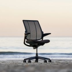 A Humanscale chair on a beach